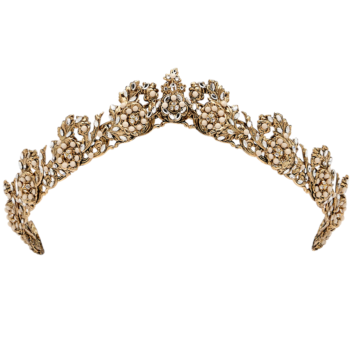 Gold tiara with floral designs on a white background